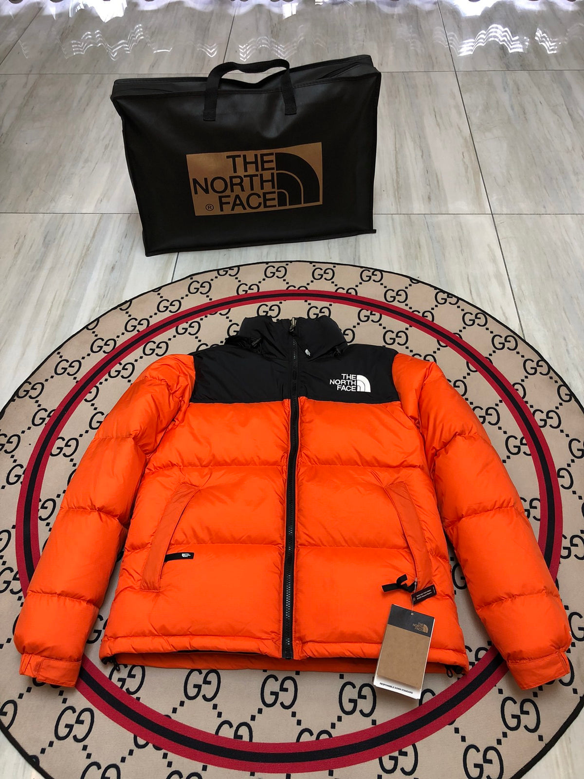 The North Face Orange Nuptse Down Jacket