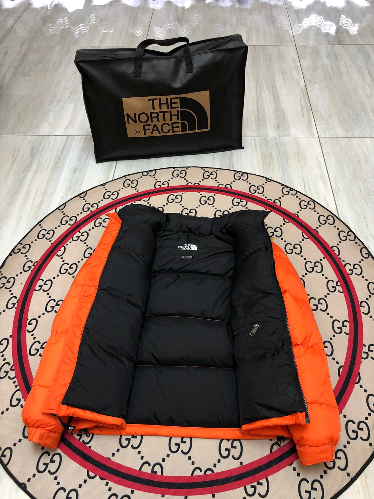 The North Face Orange Nuptse Down Jacket