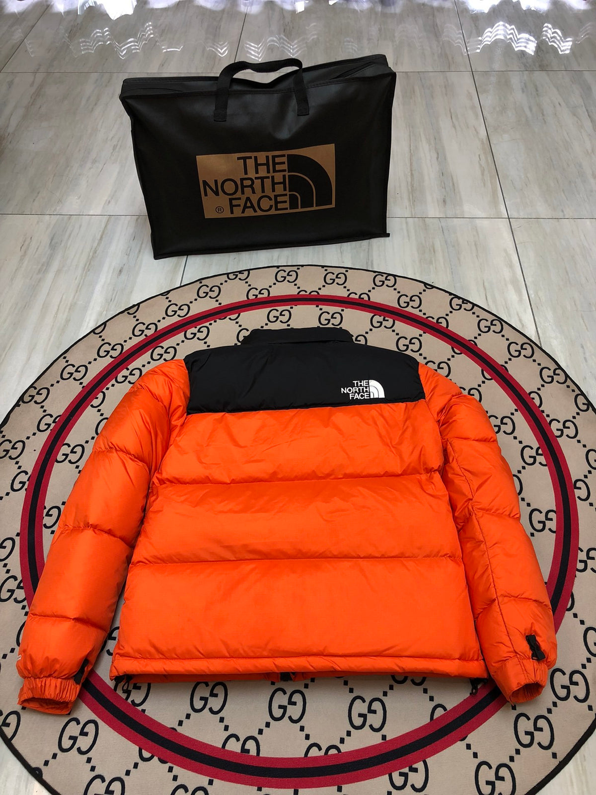 The North Face Orange Nuptse Down Jacket