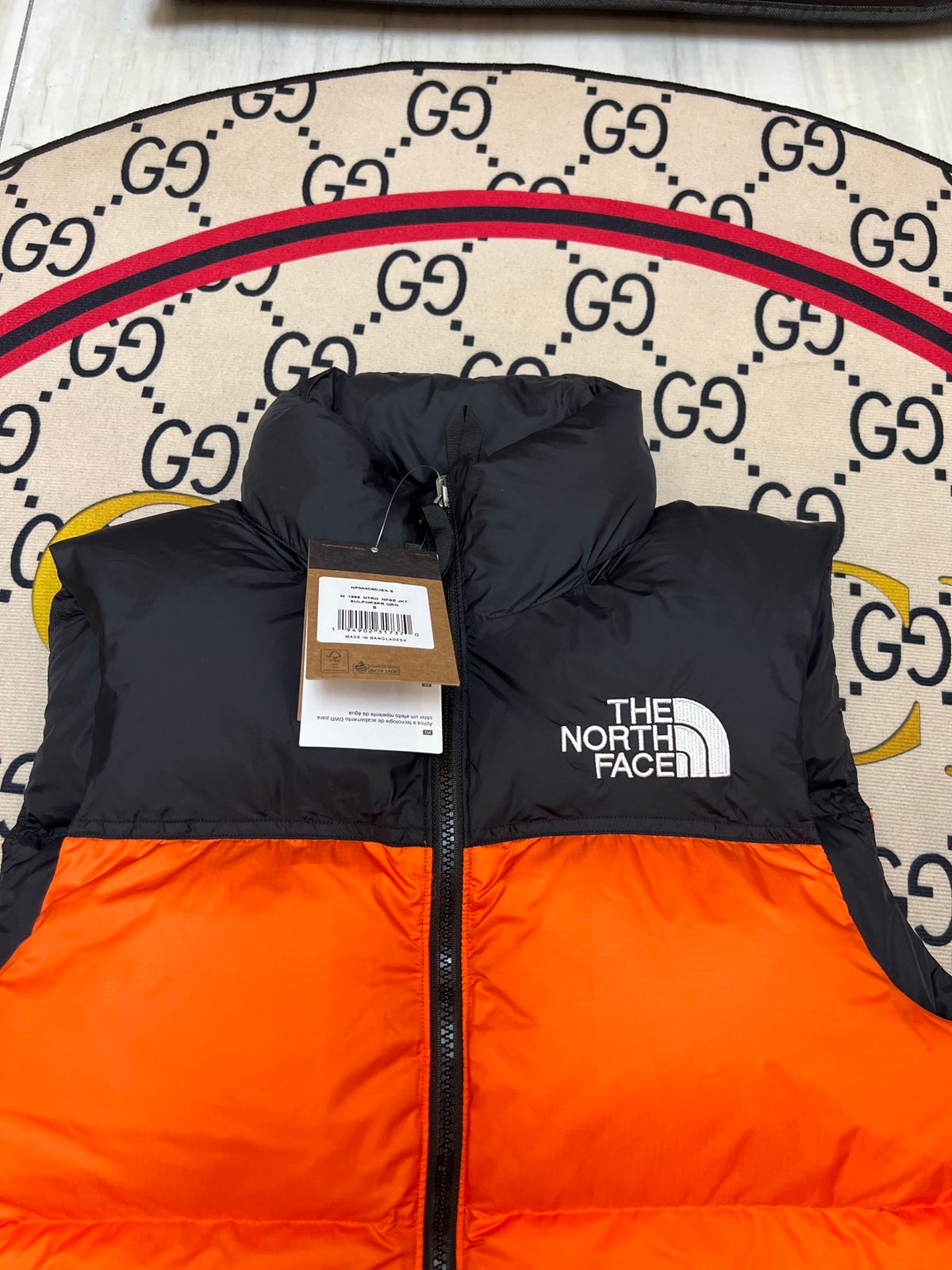 The North Face Orange Nuptse 700 Puffer Vest